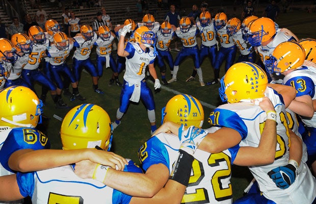 A Tempe Prep (Ariz.) player fires up his teammates before the start of their game against Northwest Christian.