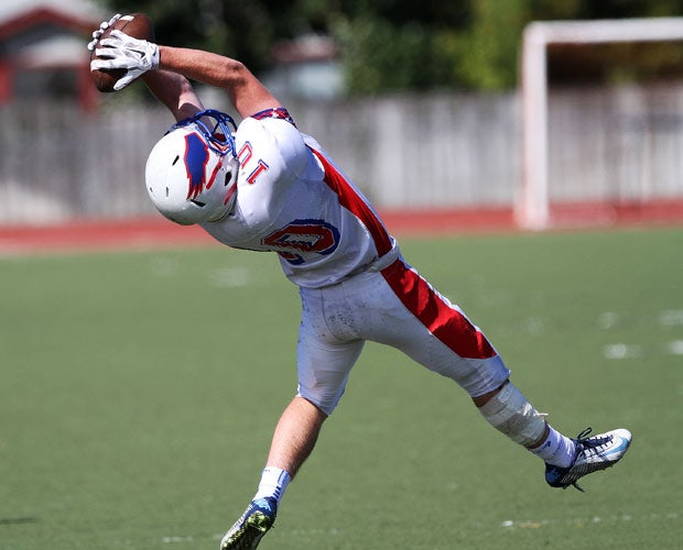Tamalpais (Calif.) receiver Kiefer Dickson makes a leaping over-the-shoulder catch during a game against Piner.