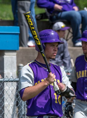 Josh Ruchotzke prepares for an at-bat, using theBatzilla apparatus.