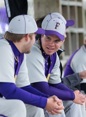 Josh Ruchotzke talking with a teammate.