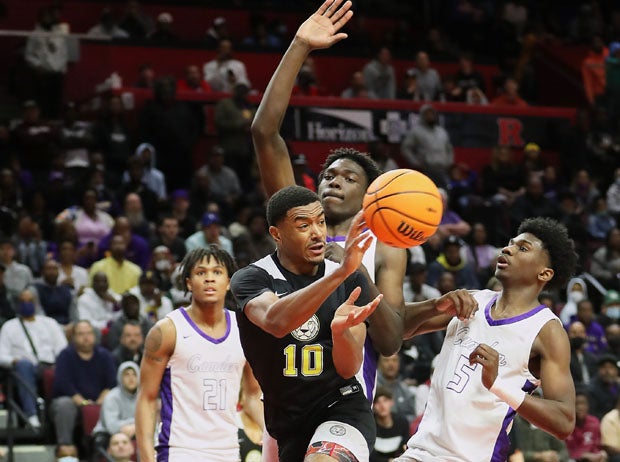Roselle Catholic senior guard Jamarques Lawrence (10) passes to a teammate for a deuce.