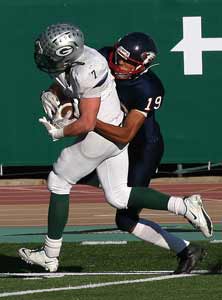 Arik Bird drags a defender with him on his game-winning touchdown run for Granite Bay.