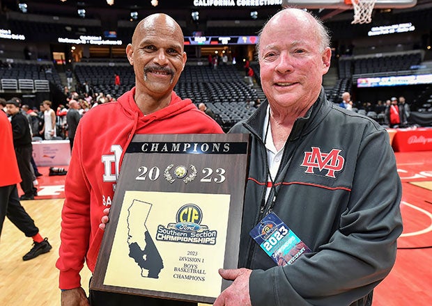 Gary McKnight (right) celebrates last season's Southern Section Division 1 title win with longtime assistant coach Jason Quinn. Under McKnight's guidance, Mater Dei has won 24 section titles and 11 state crowns. (Photo: Louis Lopez)