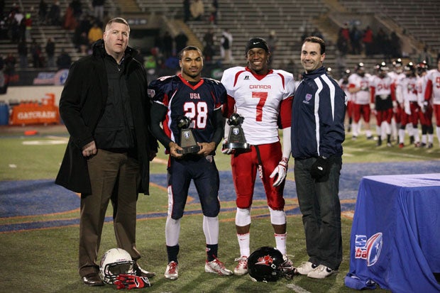 Game MVPs Charles Nelson (28) of USA and Canada's Trivel Pinto (7) pose following a 43-7 USA victory in the U19 International Bowl game at the University of Texas-Arlington's Maverick Stadium on Friday.