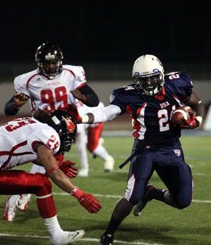 St. Peter's Prep running back Jonathan Hilliman
stiff arms a defender in USA's 43-7 win over 
Canada. Hillman is headed to Boston College. 