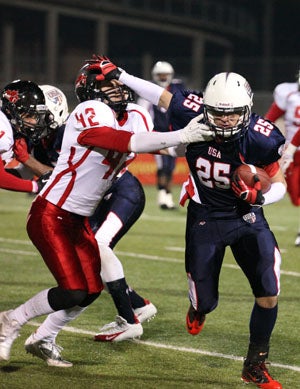 Lovejoy senior receiver Justice Lucé stiff arms
Josh Dahl during USA's 43-7 win on Friday. Luce
is headed to Texas A&M-Commerce.