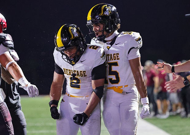 Jonathan Bueno Jr. (2) and Michael Stringer (15) celebrate a score in No. 7 American Heritage's incredible comeback victory over St. Joseph's Prep. (PHOTO: Jeff Klein)