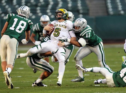 Michael Barton (11) and Austin Hooper (18) help lead one of De La Salle's top defenses.
