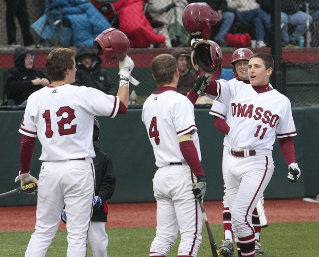 Shortstop Jonah Bride (right) celebrates with teammates at home plate after hitting a home run last season. The Rams have eight returning starters from last year's team that finished undefeated with a school-record 36 wins and 6A state championship.