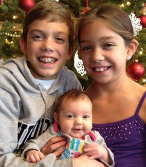 A Christmas photo with new born Caroline Jane
along with Aaron and Abigail. 