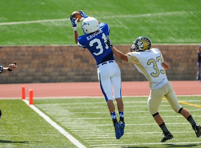 Jake Krough of Legend (Parker, Colo.) makes the catch in front of Cory Orr from Prairie View (Henderson, Colo.).