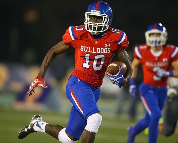 Folsom receiver Joe Ngata scores on a 49-yard touchdown reception during the first half.