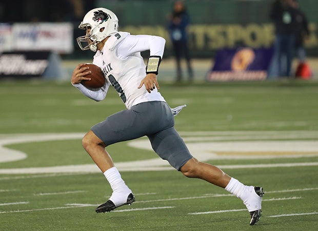 Helix quarterback Carson Baker breaks into the open during the first half.
