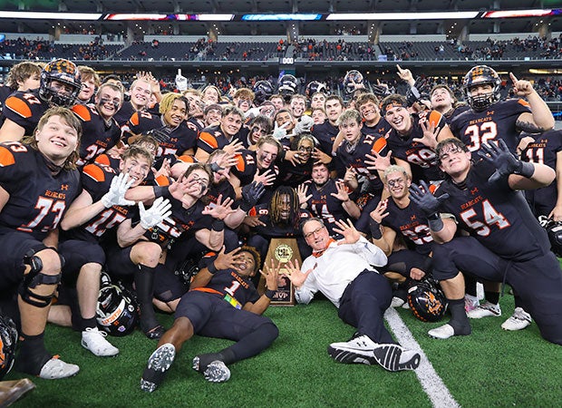 Aledo head coach Tim Buchanan and his players celebrate winning the school's 10th state football championship.