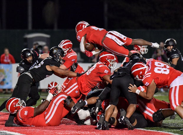 Mater Dei's Raleek Brown (4) flipped into the end zone in Friday's 27-7 win over Servite to win the Southern Section Division I championship. 