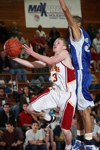 Torrey Pines guard Max Heller goes up for two of his 17 points.