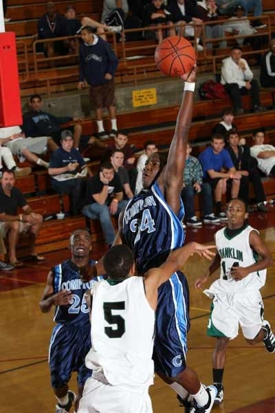 High-flyer Cliff Sims goes up for two of his 14 points.