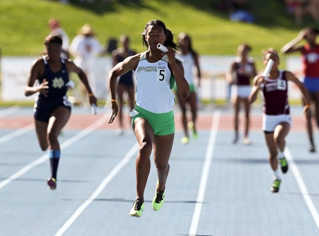 Ariana Washington, the defending California state champion in the 100 and 200, brings home Long Beach Poly's top-qualifying 400 relay win in Friday's CIF State Meet trials at Veterans Stadium in Clovis.