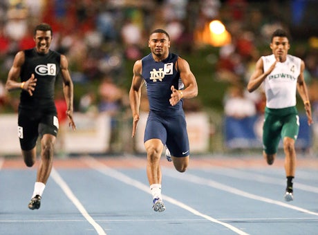 Khalfani Muhammad cruises to victory in his 200 heat en route to the day's best time.