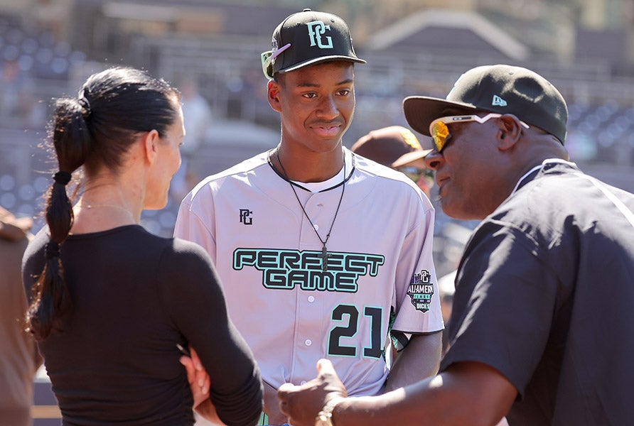 Joseph Contreras talks with coaches prior to last summer's Perfect Game All-American Classic in San Diego. At Blessed Trinity this spring, he strung together 13.1 consecutive no-hit innings. (PHOTO: Steven Silva)