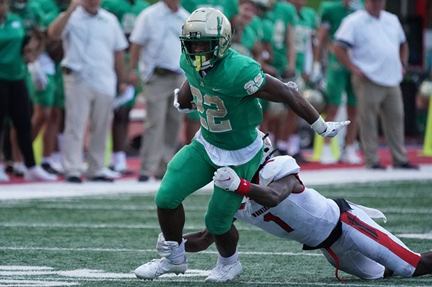 Justice Haynes evades a Thompson tackler during Buford's 38-7 win Friday.