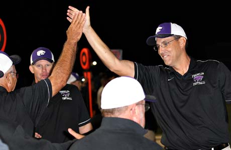 Franklin head coach Michael Johnson (right) celebrates with his assistant coaches.
