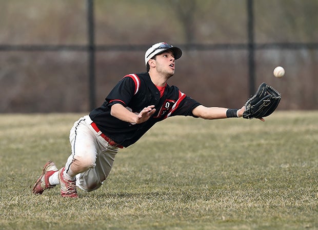 Fox Lane (N.Y.) centerfielder Antonio Chousa makes a diving catch of a fly ball during a game against visiting New Rochelle.
