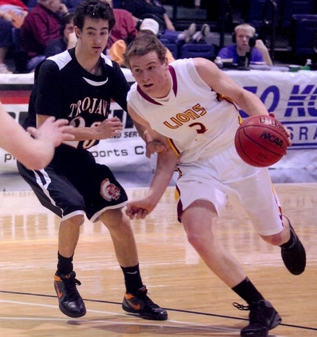 Shining Mountain's Andrew Bremner, right, is one of a handful of seniors leading the Lions' charge to an undefeated season in Class 1A.