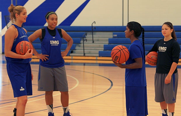 Khaleann chats with teammates Abby Tinsley of the U.S. (Virginia), Kavita Akula of India and Ellie Hill of Japan during pre-practice warm-up.