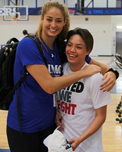 Audrey-Ann hugs her close friend and
former teammate Rina Hill.