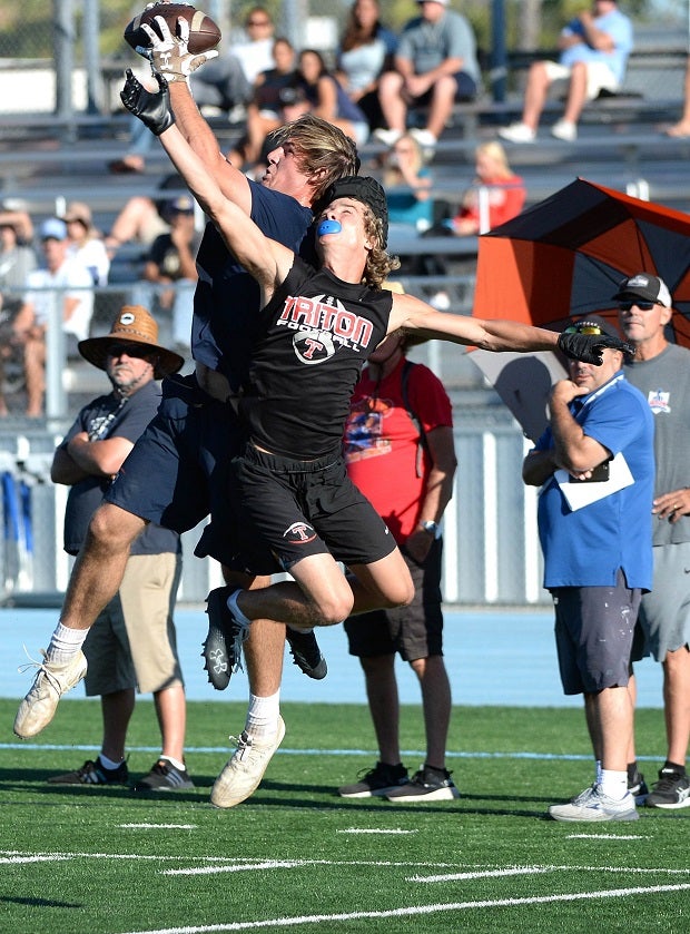 A Cypress and San Clemente player each battle for the catch during the Battle at the Bay 7 on 7 competition in Southern California.