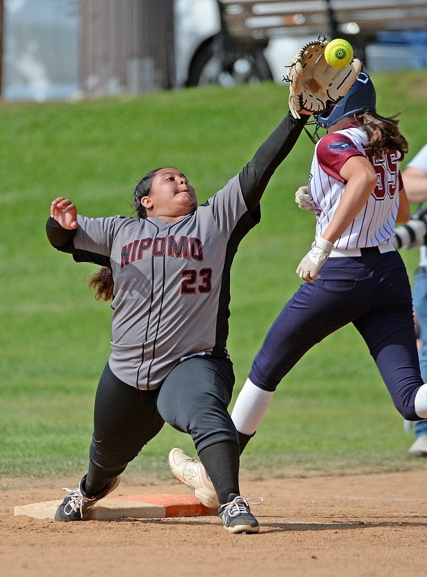 Nipomo first baseman C.J. Arias stretches, but Capistrano Valley Christian's Katelyn Cammarato beats the throw in their CIF SoCal D5 semifinal. Nipomo beat the Eagles 6-5.