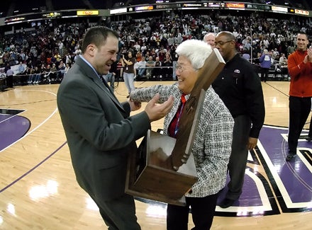 Salesian coach Bill Mellis accepts trophy from CIF Executive Director Marie Ishida. 