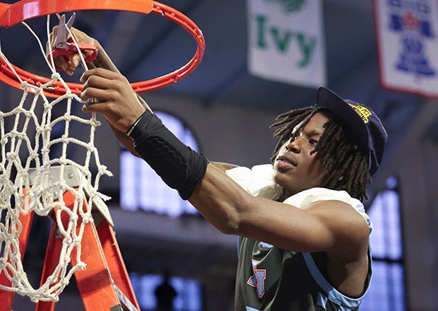 Kevair Kennedy cuts down the nets to celebrate winning Philadelphia Catholic League title. (PHOTO: Marcus Handy)