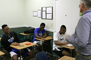 From left to right, Japhet Kadji, Micah Glenn and
Cooper sit down to take their U.S. History final
exam.