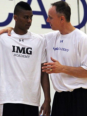 Head coach John Mahoney offers guidance to
Cooper between drills at practice.