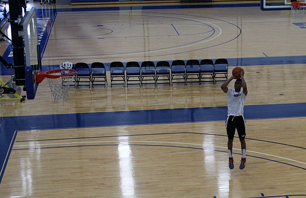 Eric Cooper gets in early for a shoot-around before class.
