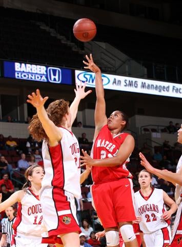 Kaleena Mosqueda-Lewis shoots over long arm of Carondelet.