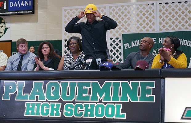 Plaquemine (La.) safely Todd Harris makes his college choice known by putting on a LSU hat.
