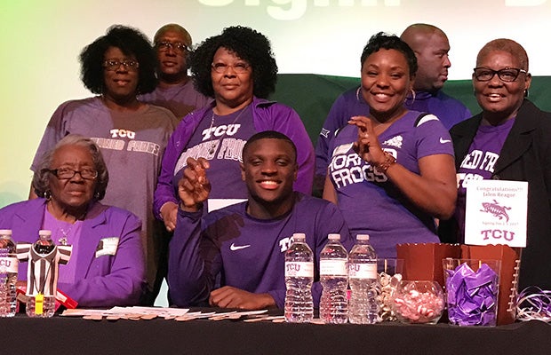 Waxahachie (Texas) receiver Jalen Reagor celebrates with family after announcing he will attend TCU.