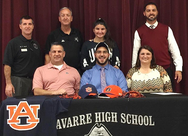 Navaree (Fla.) offensive lineman Nick Brahms proudly signed with Auburn as family members looked on.