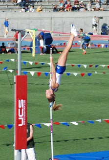 Taylore Jacques goes straight up
for her winning vault at the state
track and field championships.
