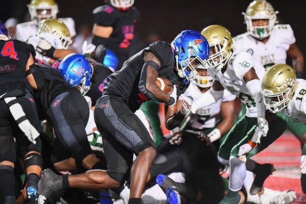 Damian Henderson had a monster night for Los Alamitos with four touchdowns as the Griffins beat No. 22 Long Beach Poly 52-42 in the CIF Southern Section Division 1 quarterfinals. Los Al now gets national No. 1 Mater Dei in the semifinals. (Photo: Antoine Belot)
