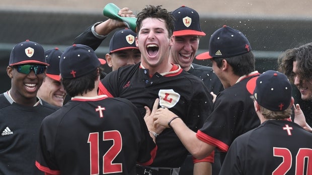 Composite No. 1 Orange Lutheran celebrates an extra innings victory over league rival Servite on April 20.