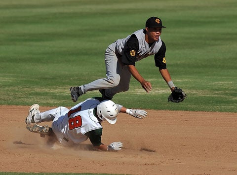 Jordan Castro of Capistrano Valley turns the double play against Riverside Poly.