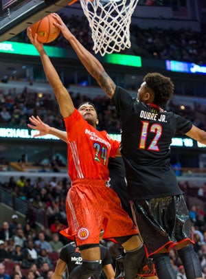 Kelly Oubre Jr. (12) gets Allocco's message to
contest with a big block here. 