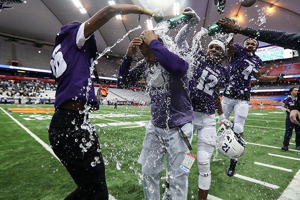 New Rochelle celebrates a victory in last year's NYSPHSAA Class AA championship game at the Carrier Dome.
