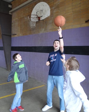 Smith volunteers with local grade-school children.
