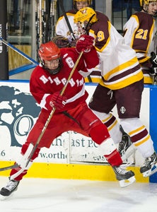 Hingham, Weymouth players battle.