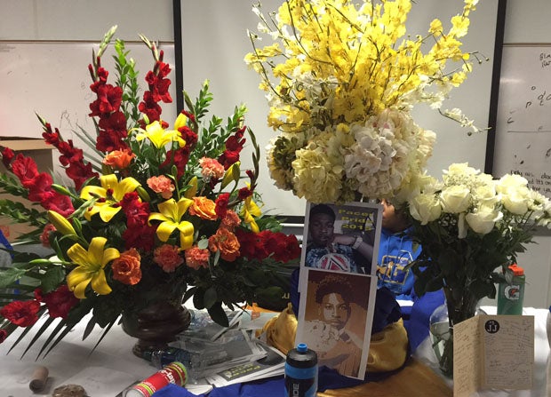 A shrine with flowers to honor JJ Clavo was displayed in the Grant locker room.
